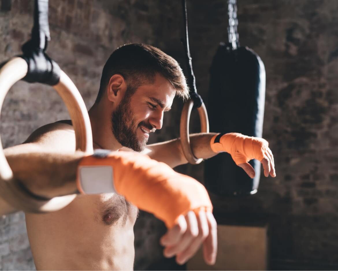 sporty-man-exercising-with-rings-2024-01-17-12-55-04-utc (1)