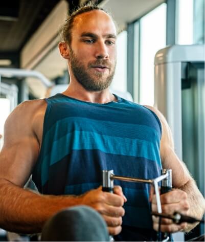 muscular-man-working-out-in-gym-doing-exercises-to-2023-11-27-05-01-44-utc (1)